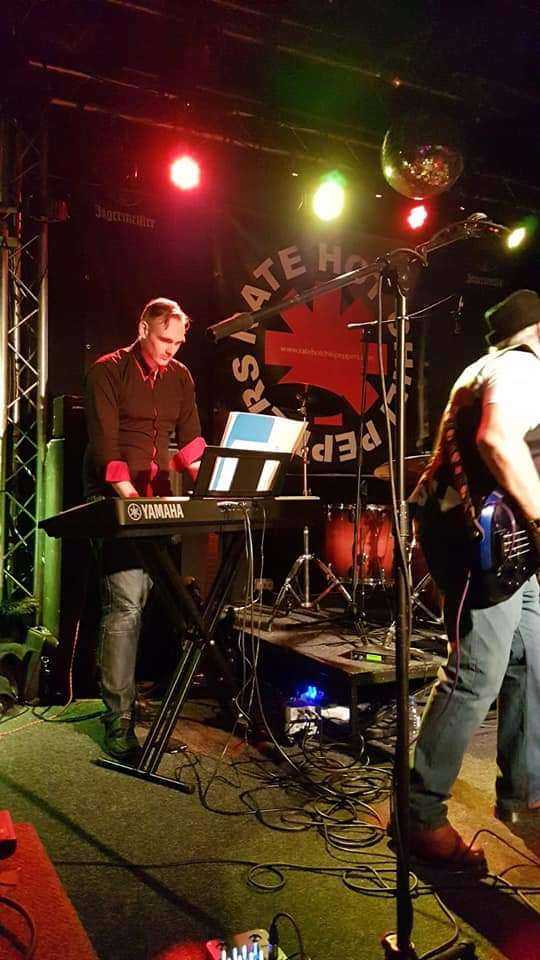 Billy playing the keyboard in a musical group